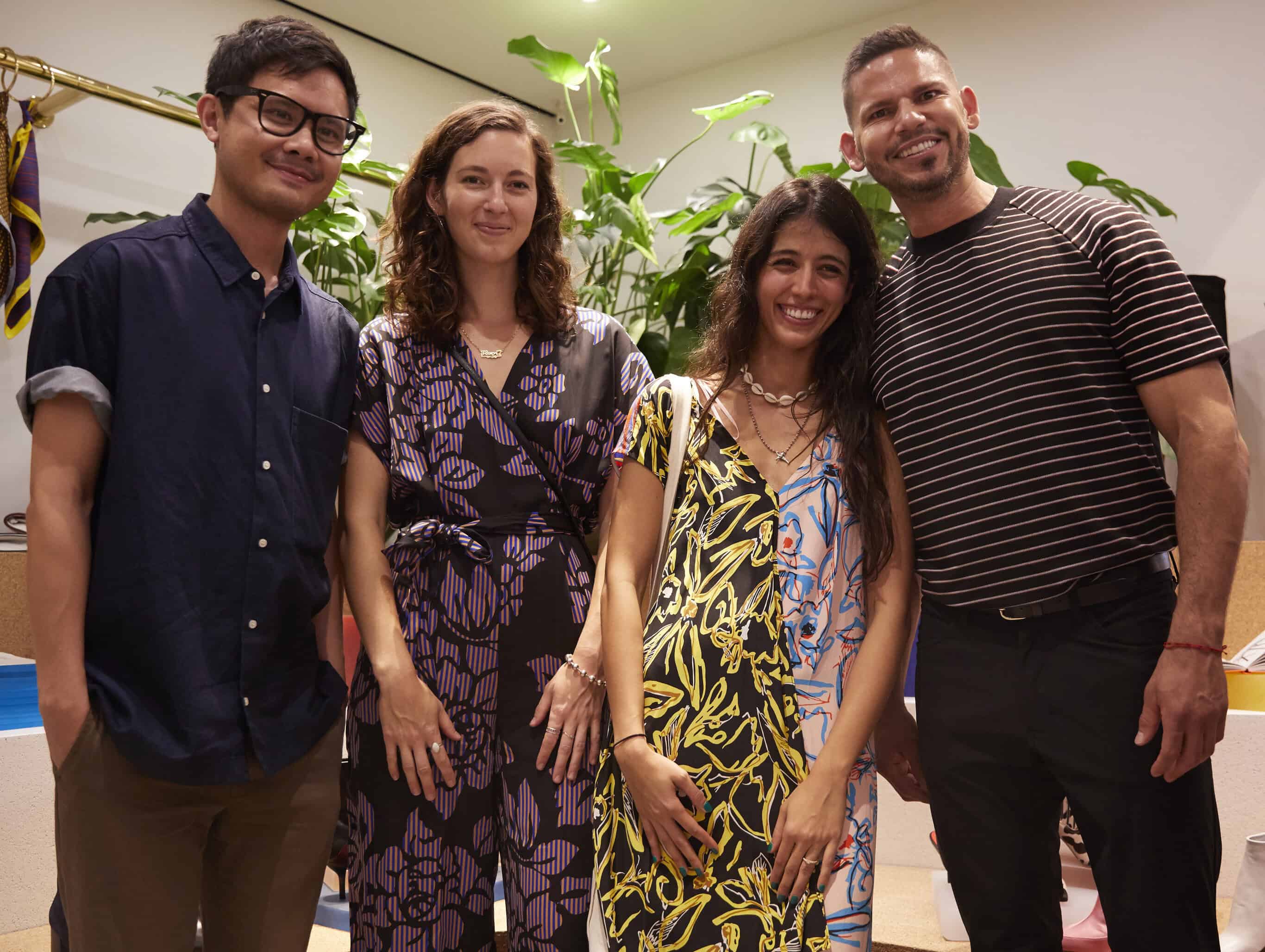 Moheb-Zandi (second from right) wearing the Elsden print that inspired her tapestries.