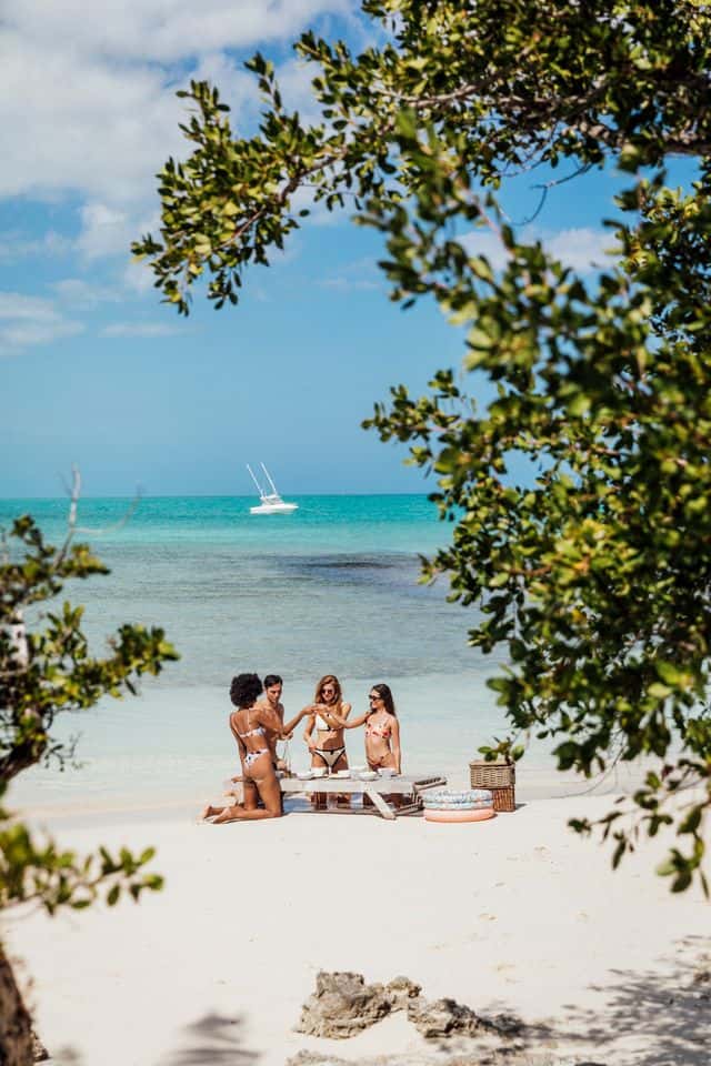 daylight color photograph of people on beach