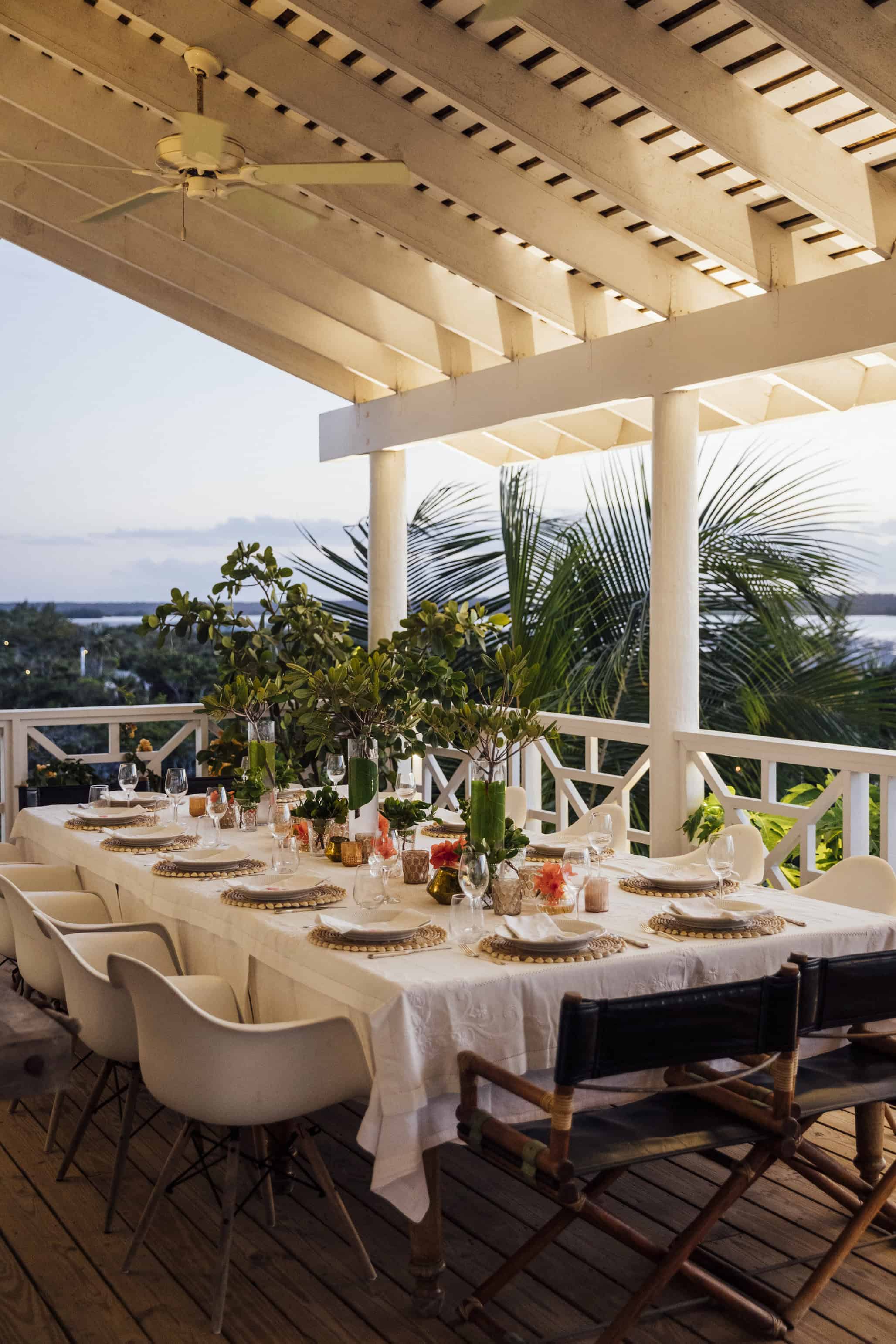 color photograph of dining area on seaside balcony